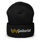 Black cuffed beanie with "LeftyGuitarist" embroidered in gold and white on the front.