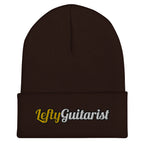 Brown cuffed beanie featuring "LeftyGuitarist" embroidered in gold and silver on the front.