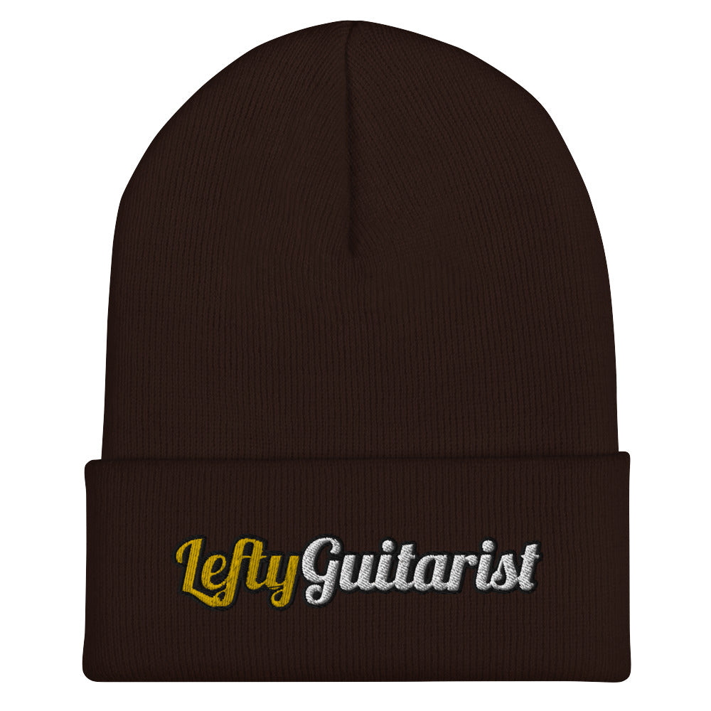 Brown cuffed beanie featuring "LeftyGuitarist" embroidered in gold and silver on the front.