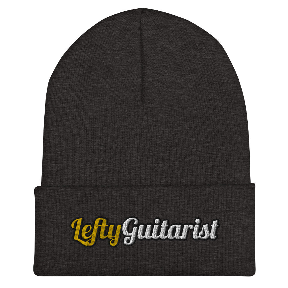 Dark grey cuffed beanie featuring the embroidered text "LeftyGuitarist" in gold and silver colors.