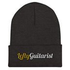 Dark grey cuffed beanie featuring the embroidered text "LeftyGuitarist" in gold and silver colors.