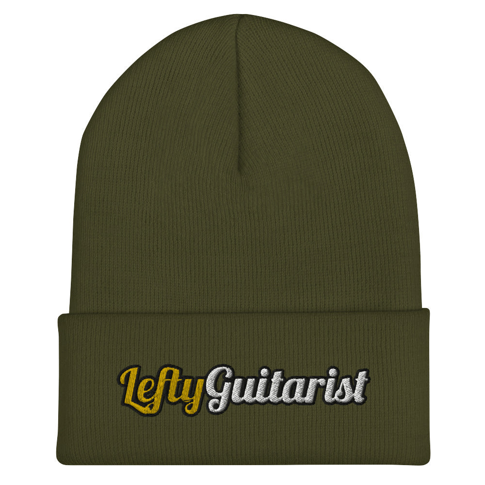 Olive green unisex beanie with "LeftyGuitarist" embroidered in yellow and white on the cuff.