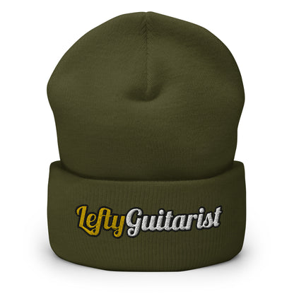 Olive green cuffed beanie with "LeftyGuitarist" embroidered in white and gold on the front.