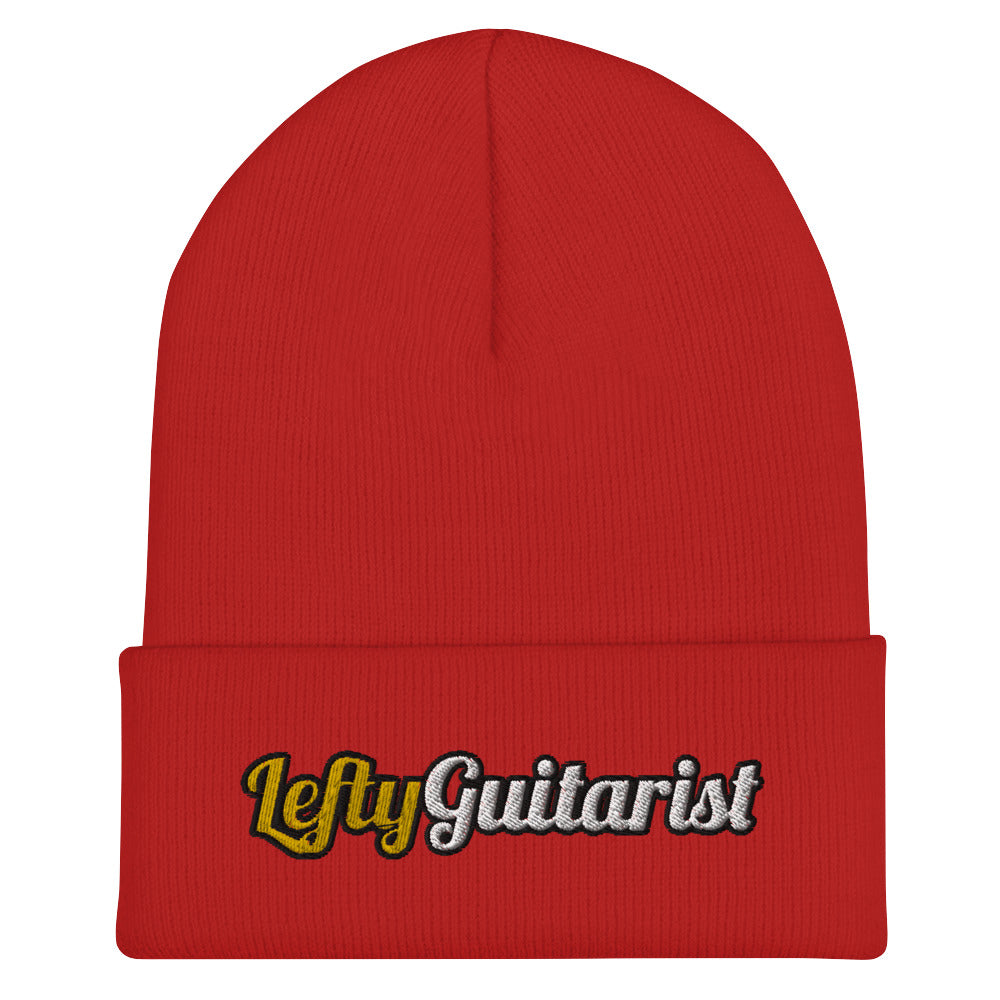 Red cuffed beanie featuring the embroidered text "LeftyGuitarist" in white and yellow on the front.