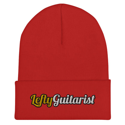Red cuffed beanie featuring the embroidered text "LeftyGuitarist" in white and yellow on the front.