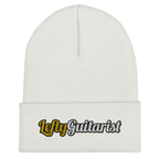White cuffed beanie featuring "LeftyGuitarist" embroidered in black and yellow on the front.