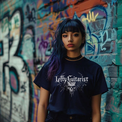 Navy blue LeftyGuitarist "Skull" logo T-shirt worn by a model against a colorful graffiti wall.
