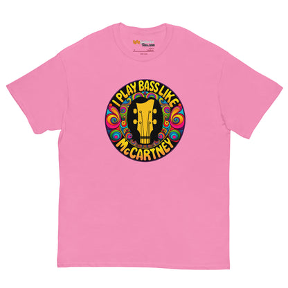 Pink unisex t-shirt featuring a circular graphic with the text "I play bass like McCartney" and a guitar illustration.