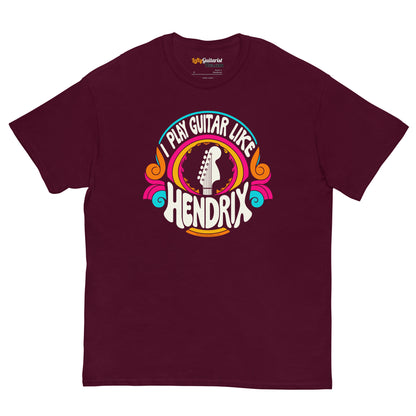 Maroon unisex t-shirt featuring a colorful graphic that reads "I play guitar like HENDRIX" with a guitar headstock illustration.