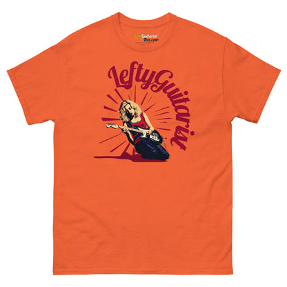 Lefty blonde guitarist unisex T-shirt in orange featuring a graphic of a female guitarist with a sunburst background.