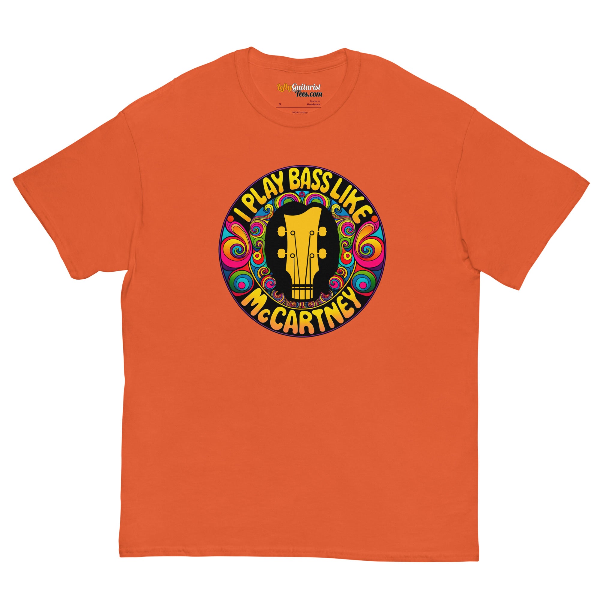 Orange unisex t-shirt featuring a circular graphic with "I play bass like McCartney" and a guitar design.
