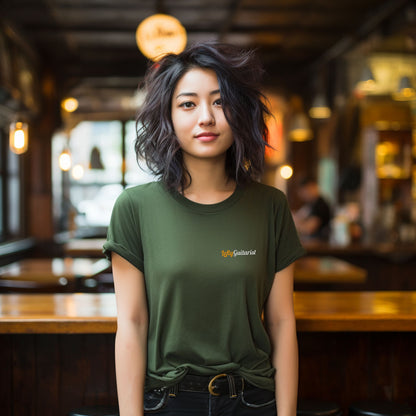 LeftyGuitarist small logo unisex t-shirt in military green worn by a woman with messy hair in a café setting.