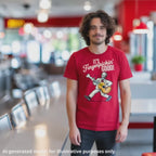 Brown-haired man wearing a red unisex T-shirt featuring a white-haired man in a white suite playing a left handed guitar made out of a chicken drumstick, featuring the text "It's Fingerpickin' Good!".