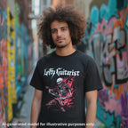 Flaming red skeleton graphic on a black unisex T-shirt, worn by a man against a graffiti-covered wall.