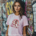 Pink unisex T-shirt featuring an Amazon Warrior playing a left handed Les Paul style guitar, worn by a woman against a colorful graffiti background.