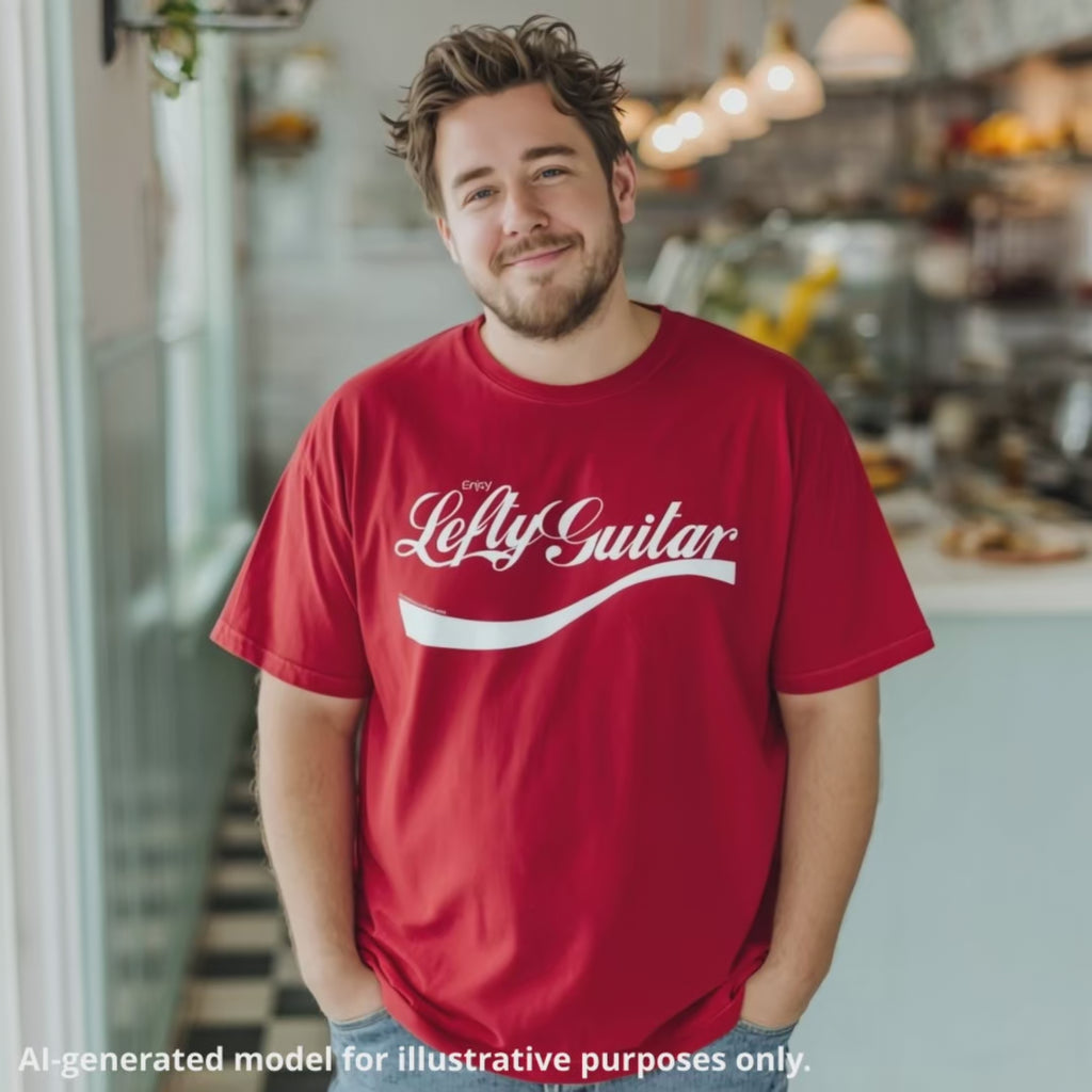 Brown-haired man wearing a red unisex T-shirt featuring the text "Enjoy Lefty Guitar" in a cursive text design.
