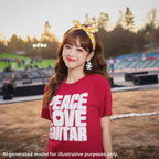 Japanese woman with long brown hair wearing a red unisex T-shirt featuring a large block of white text that reads "PEACE LOVE LEFTY GUITAR".