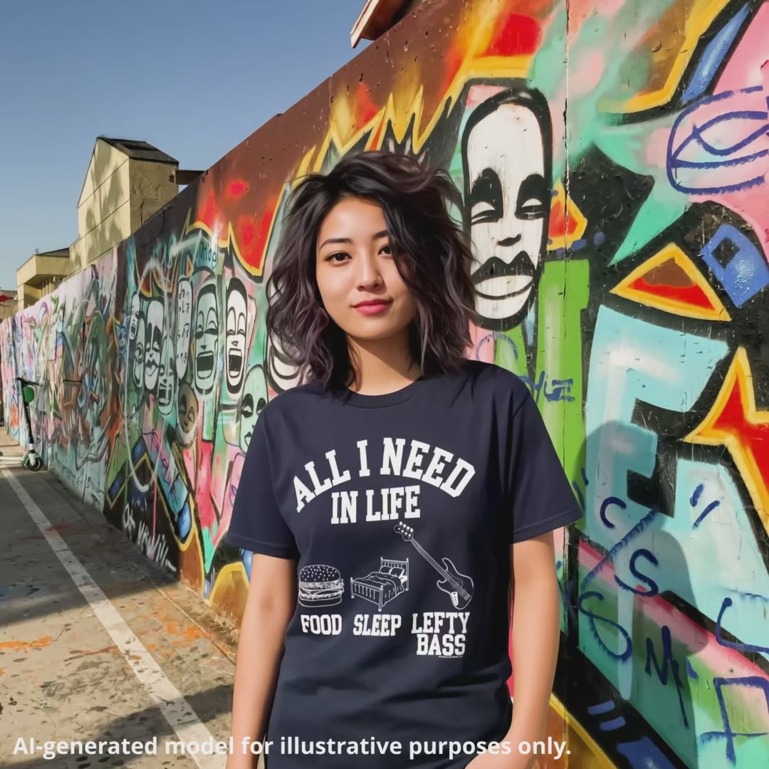 Navy unisex t-shirt featuring the white text "All I Need in Life" with icons for food, sleep, and a left-handed bass guitar.