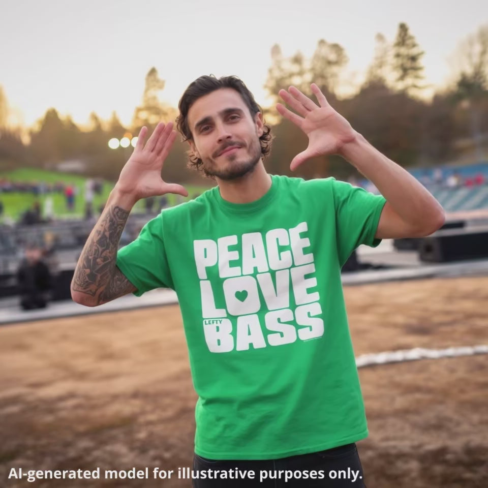 American man with brown hair wearing an Irish green unisex T-shirt featuring a large block of white text that reads "PEACE LOVE LEFTY BASS".