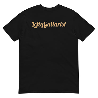 The back side of a black unisex T-shirt featuring "LeftyGuitarist" text in a light tan color on the back.