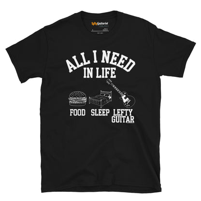 Black unisex t-shirt featuring the phrase "All I Need in Life - Food, Sleep, Lefty Guitar" with graphics of a burger, bed and left handed guitar.