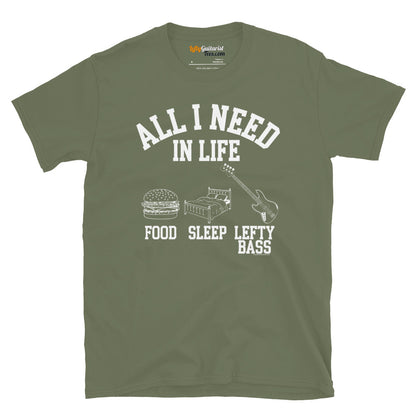Military green unisex T-shirt featuring the white text "All I Need in Life - Food, Sleep, Lefty Bass" with icons of a burger, bed and a left handed bass guitar