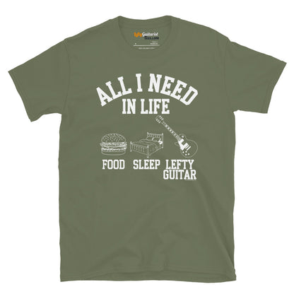 Military green unisex T-shirt featuring the text "All I Need in Life - Food, Sleep, Lefty Guitar" with graphic icons of a burger, bed and left handed guitar..