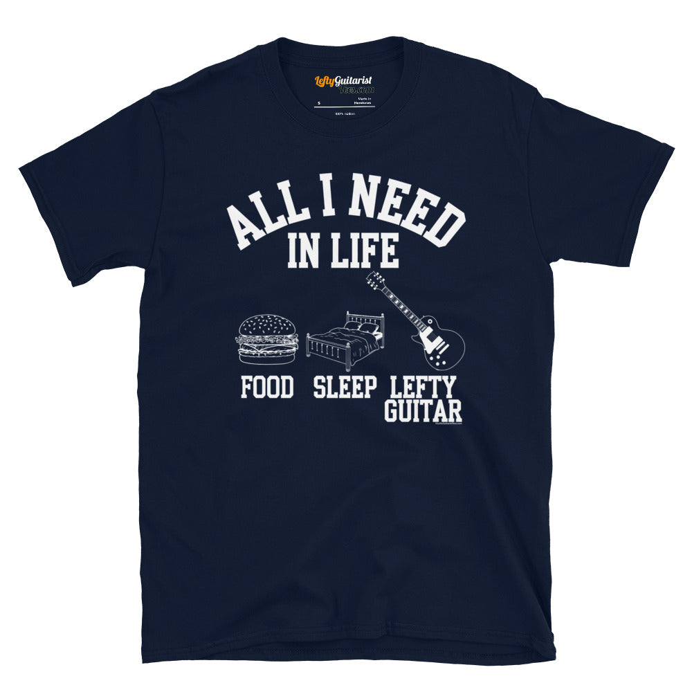 Navy unisex T-shirt featuring the text "All I need in life - food, sleep, lefty guitar" with graphics of a burger, bed and left handed guitar.