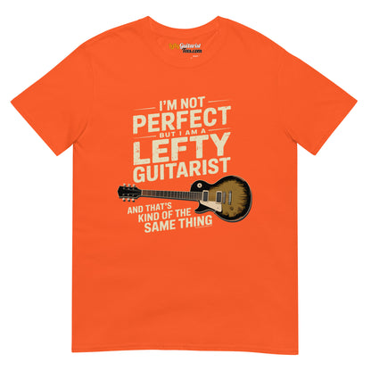 I'm Not Perfect But I Am A Lefty Guitarist" unisex orange T-shirt featuring a lefty guitar graphic and bold white text.