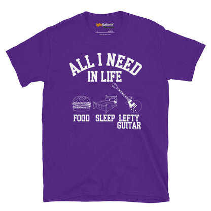 Purple unisex T-shirt featuring the text "All I Need in Life - Food, Sleep, Lefty Guitar" with icons of a burger, bed and left handed guitar.
