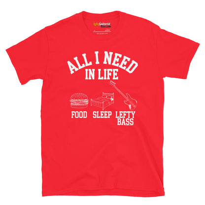 Red unisex T-shirt featuring the white text "All I Need in Life - Food, Sleep, Lefty Bass" with icons of a burger, bed,  and a left handed bass guitar
