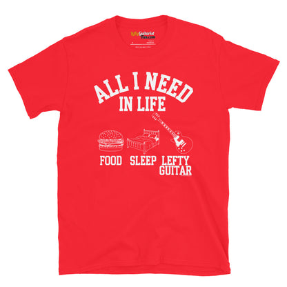 Red unisex T-shirt featuring the text "All I need in life - food, sleep, lefty guitar" with icons of a burger, bed and left handed guitar.