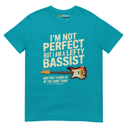 Tropical blue unisex t-shirt featuring the text "I'm not perfect but I am a lefty bassist" and a lefty bass guitar graphic.