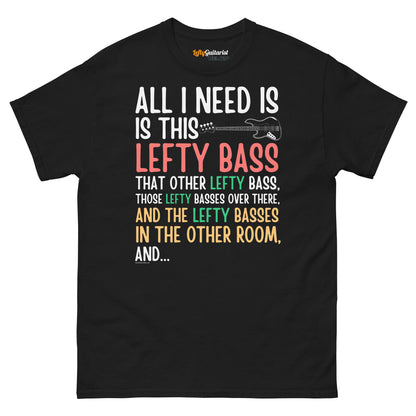 Black unisex t-shirt featuring colorful text that reads "All I need is this lefty bass" with a graphic of a left handed bass guitar.