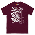 Maroon unisex t-shirt featuring the text "Life is Better with a Lefty Bass" and a lefty bass guitar graphic.