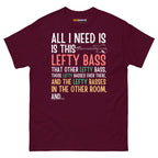 Maroon unisex t-shirt featuring colorful text that reads "All I need is this lefty bass" with playful graphics.
