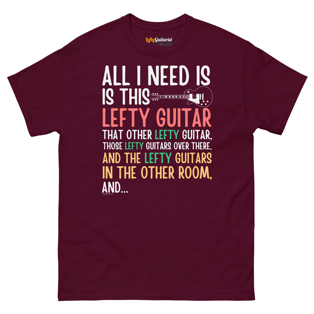 Maroon unisex t-shirt featuring colorful text that reads "All I need is this lefty guitar" with lefty guitar graphic.