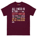 Maroon unisex t-shirt featuring colorful text that reads "All I need is this lefty guitar" with lefty guitar graphic.