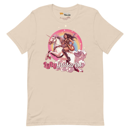 Cream unisex t-shirt featuring a unicorn warrior graphic with the text "Lefty Guitarist" in pink and rainbow background.